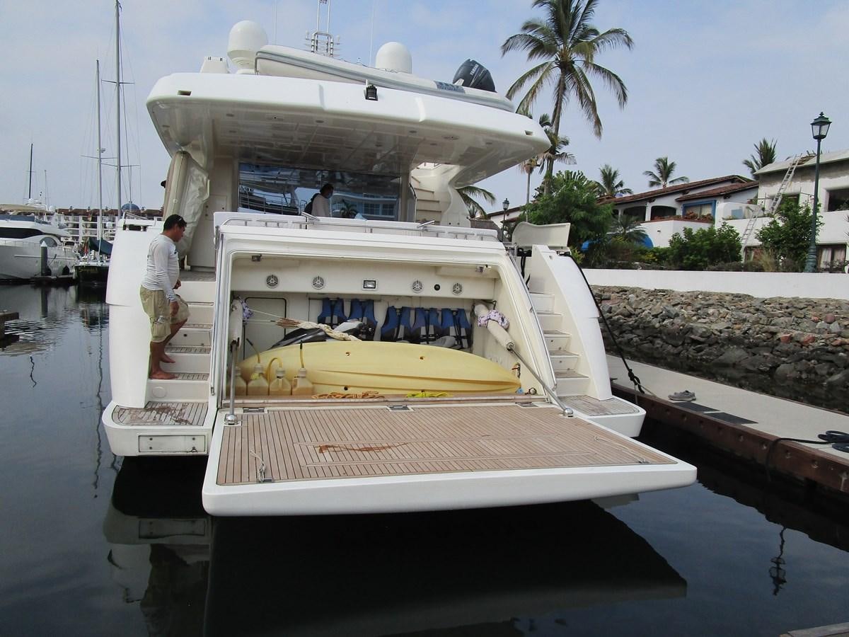 a boat docked at a pier aboard NACL Yacht for Sale