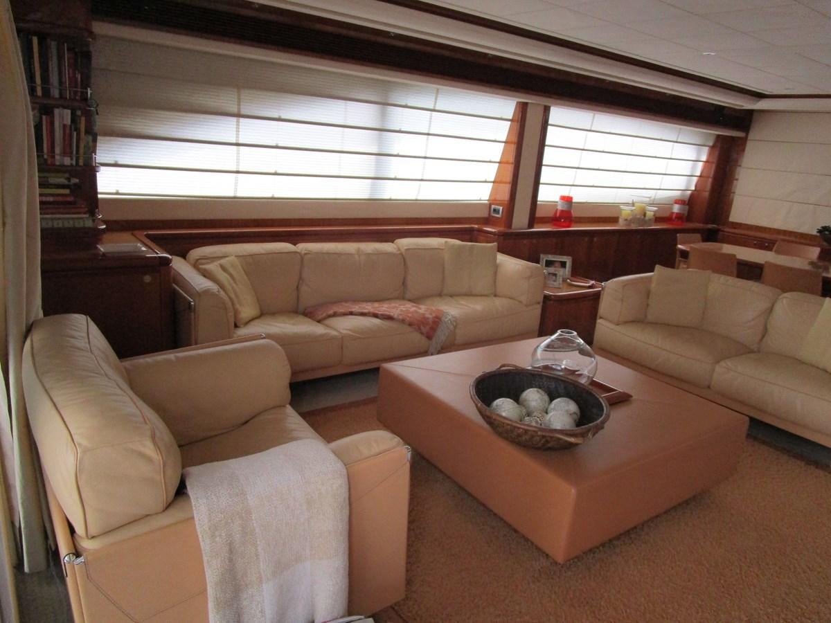 a living room with a couch and a coffee table aboard NACL Yacht for Sale