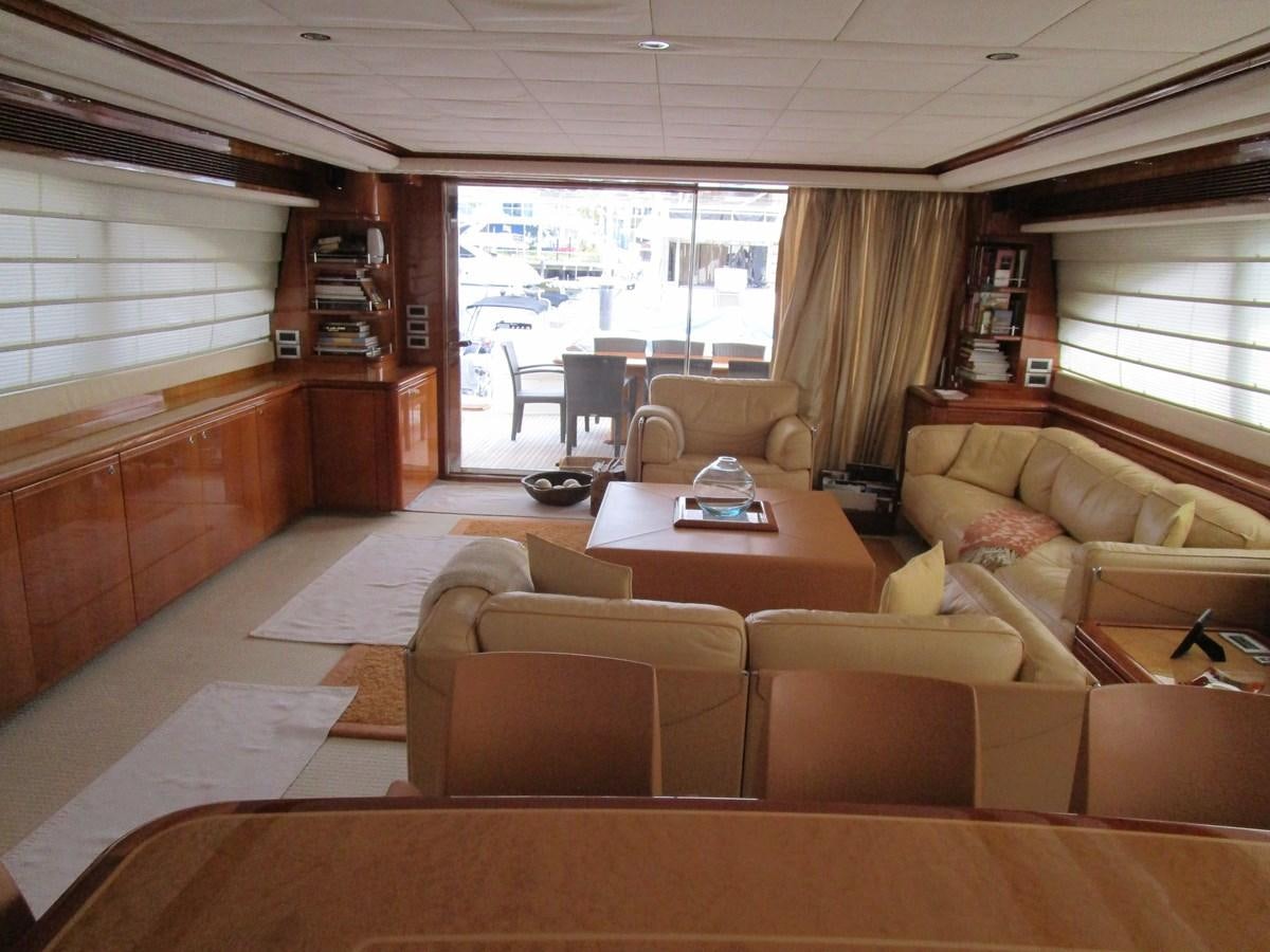 a living room with a large window aboard NACL Yacht for Sale