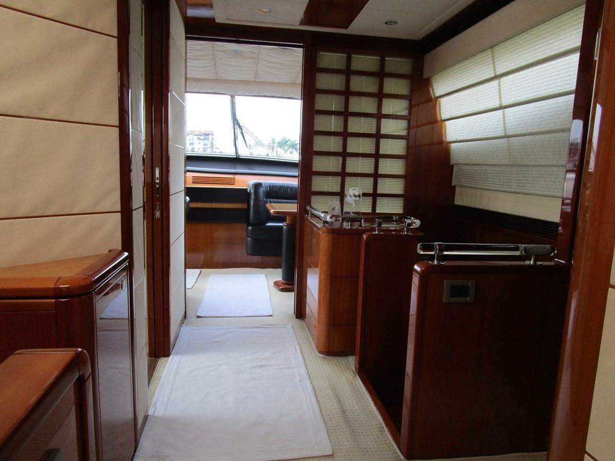 a room with a desk and a window aboard NACL Yacht for Sale