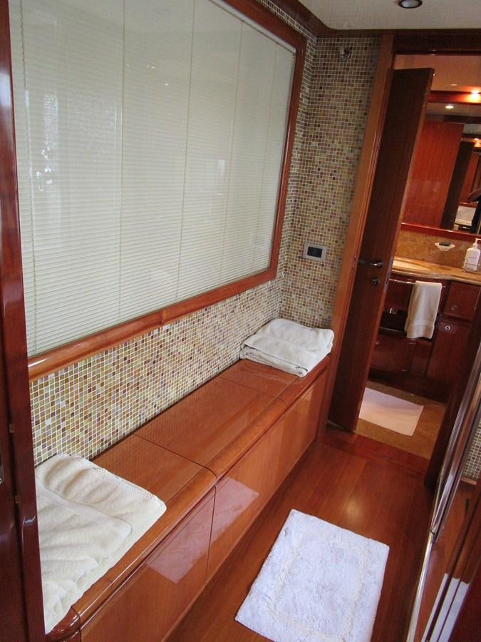 a bathroom with a sink and a mirror aboard NACL Yacht for Sale