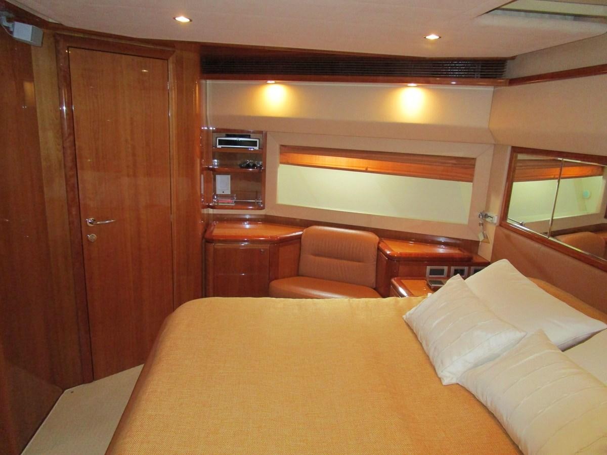 a bed in a room aboard NACL Yacht for Sale