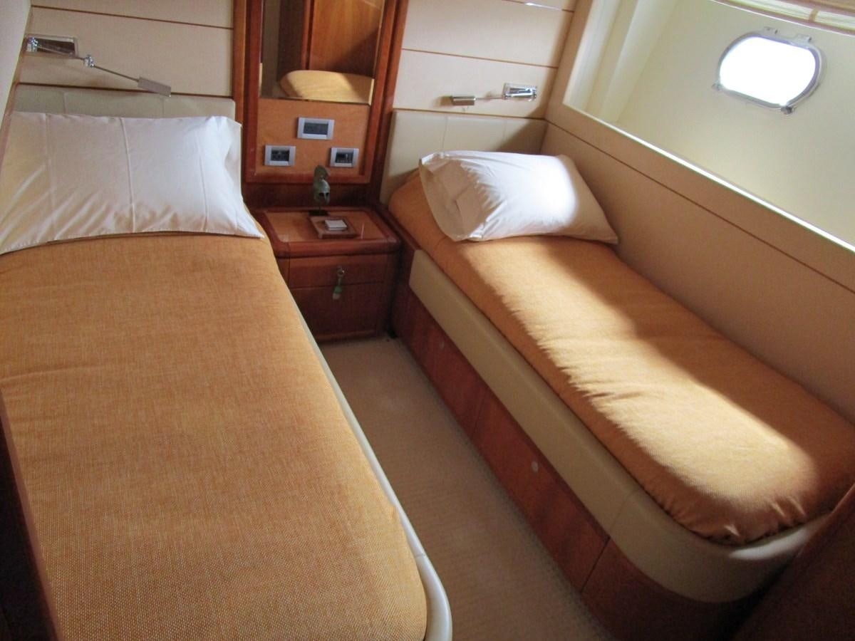 a couple of beds in a hotel room aboard NACL Yacht for Sale