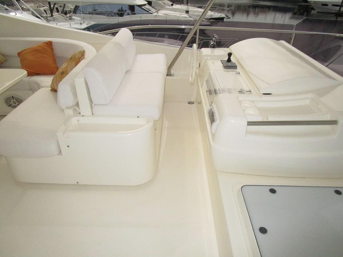 a row of white chairs aboard NACL Yacht for Sale