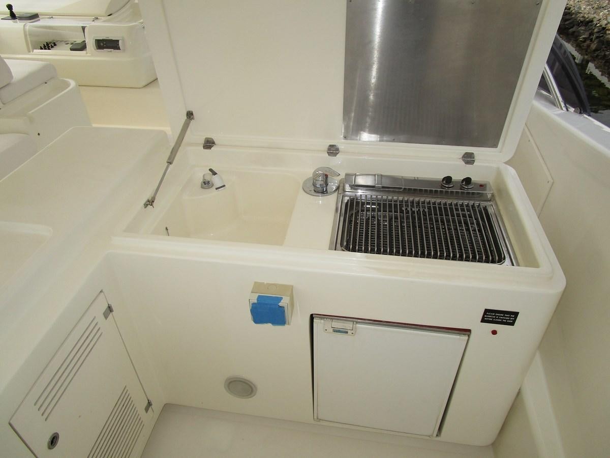 a white machine with a vent aboard NACL Yacht for Sale
