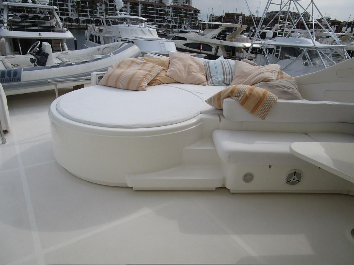 a person lying on a boat aboard NACL Yacht for Sale