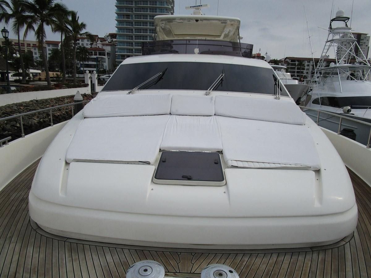 a white yacht in a dock aboard NACL Yacht for Sale