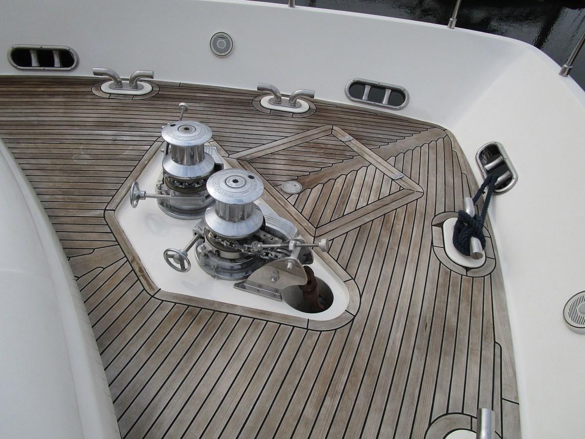 a white car with a hood aboard NACL Yacht for Sale