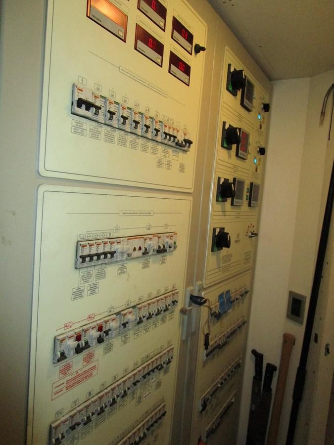 a white refrigerator with magnets aboard NACL Yacht for Sale