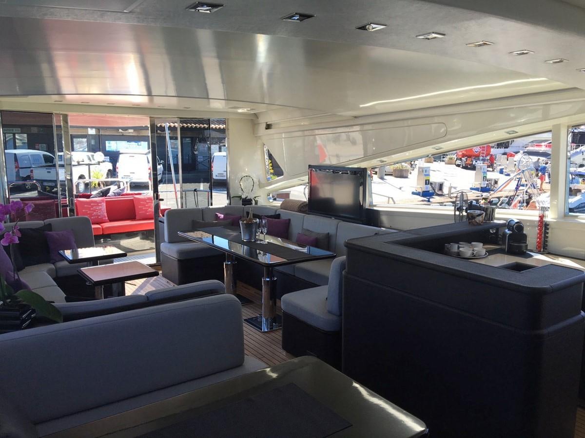 a room with a table and chairs aboard MYSVEN Yacht for Sale
