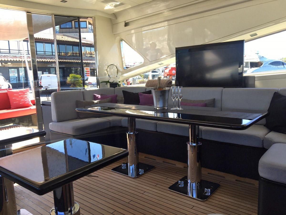 a living room with a large tv aboard MYSVEN Yacht for Sale