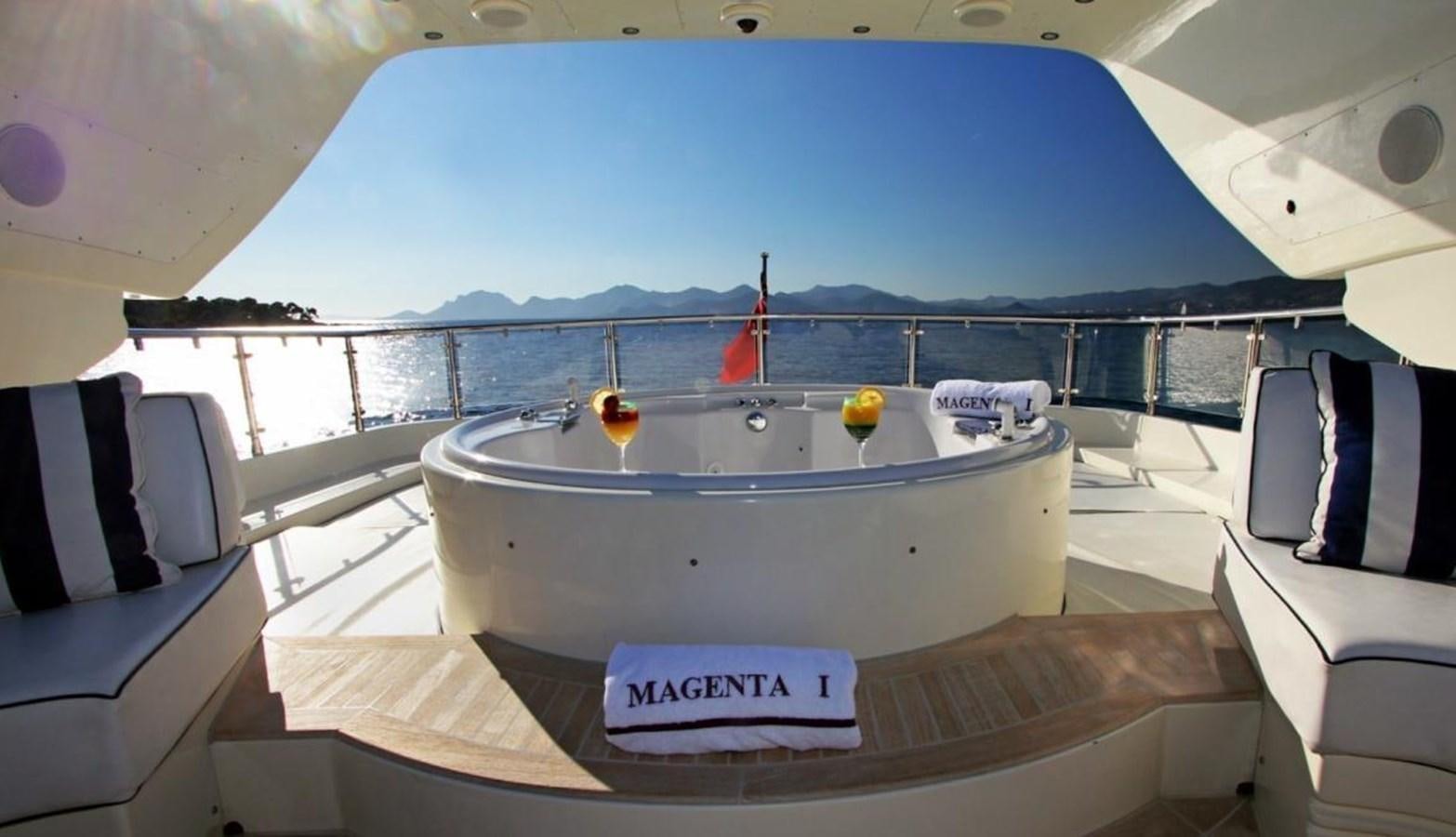 a large white tub with a red sailboat on it aboard MAGENTA I Yacht for Sale