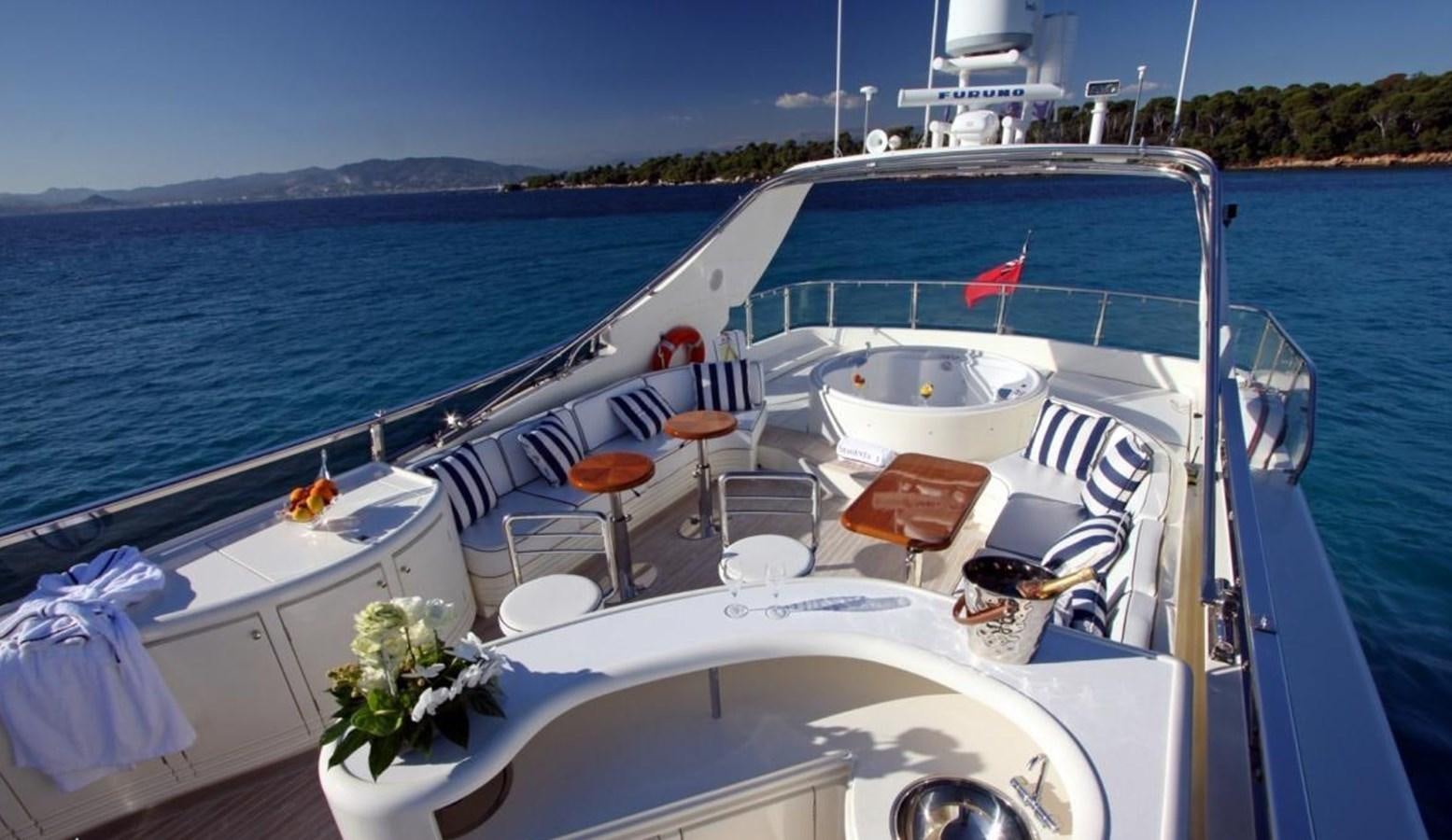 a boat with chairs on the deck aboard MAGENTA I Yacht for Sale
