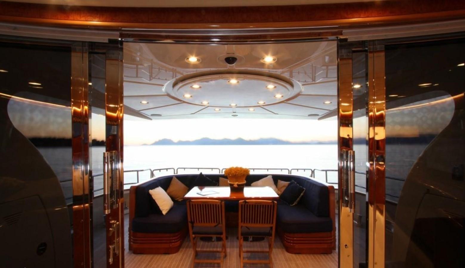 a room with a table and chairs aboard MAGENTA I Yacht for Sale