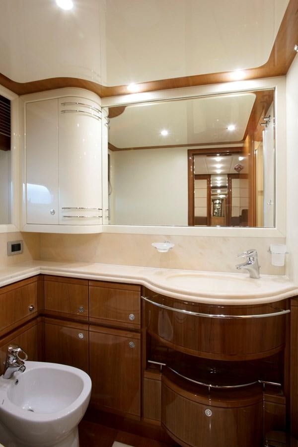 a bathroom with a sink and a mirror aboard LADY VICTORIA Yacht for Sale
