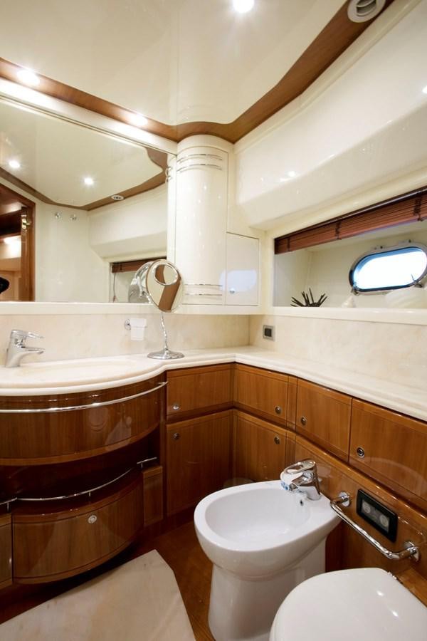 a bathroom with a toilet and a sink aboard LADY VICTORIA Yacht for Sale
