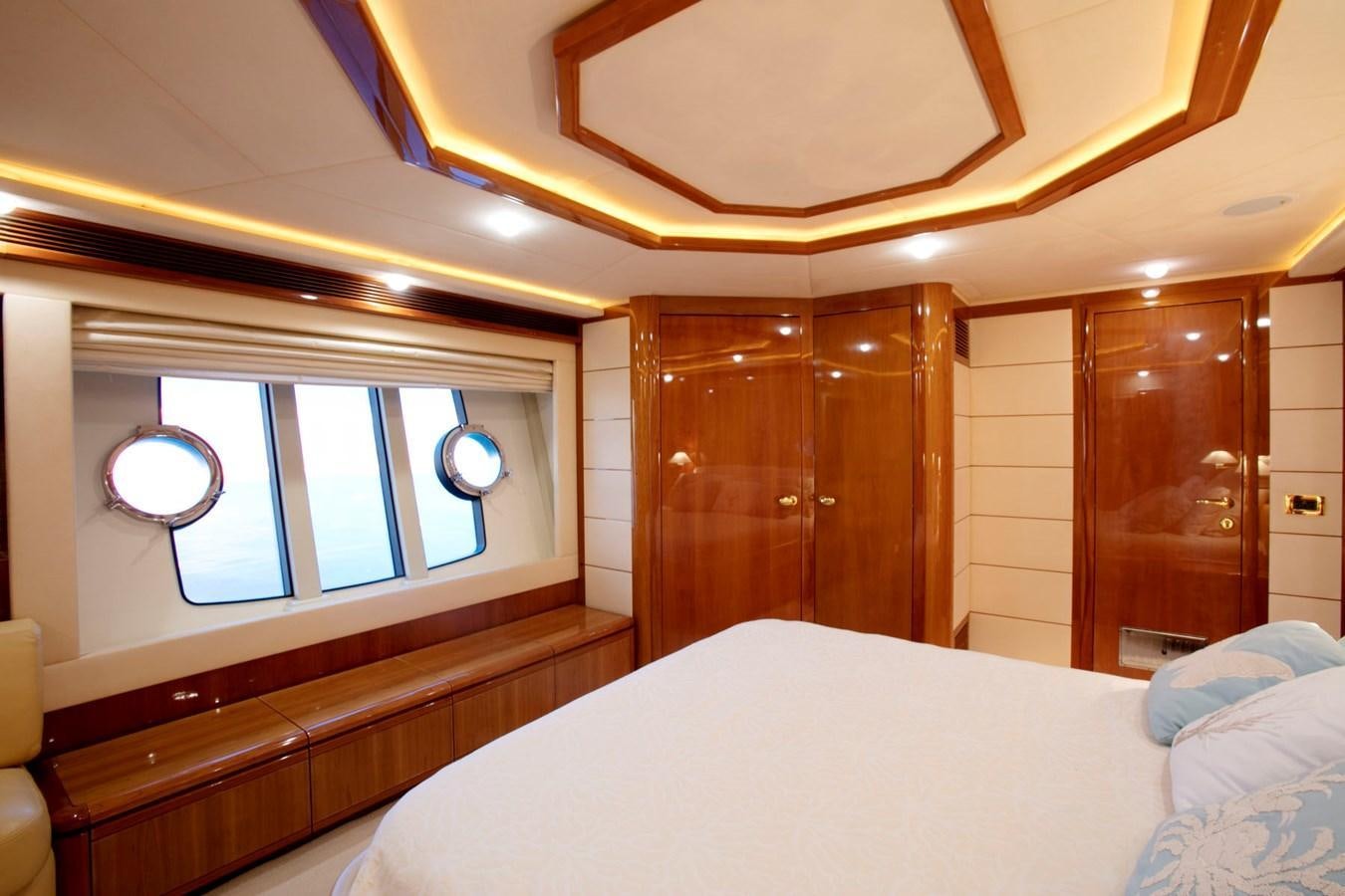 a room with a bed and a window aboard LADY VICTORIA Yacht for Sale