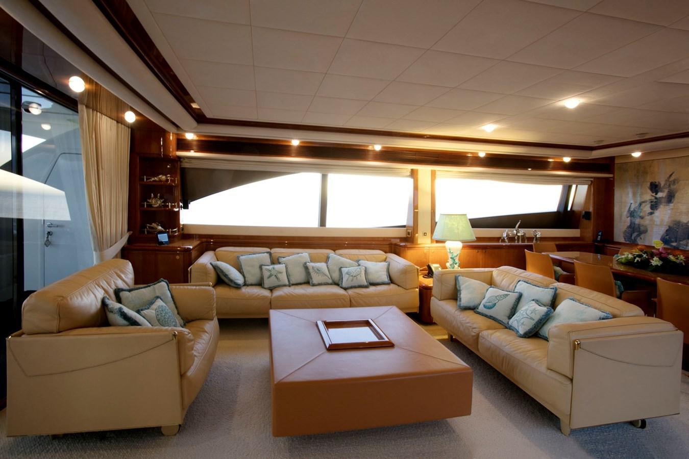 a living room with a couch and a coffee table aboard LADY VICTORIA Yacht for Sale