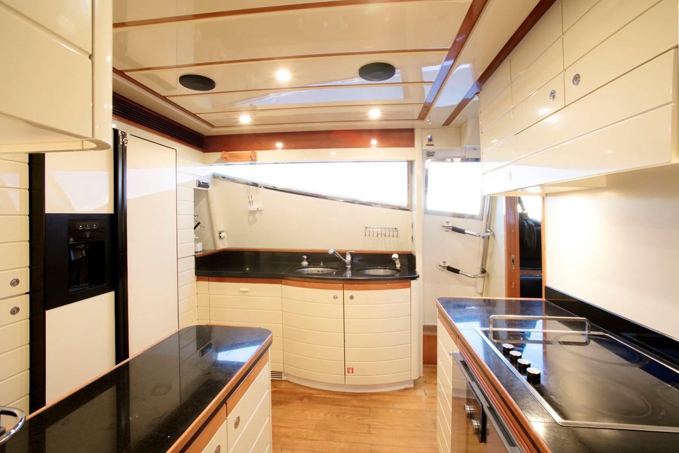 a kitchen with white cabinets aboard LADY VICTORIA Yacht for Sale