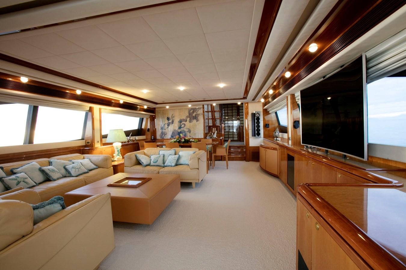 a living room with a large tv aboard LADY VICTORIA Yacht for Sale