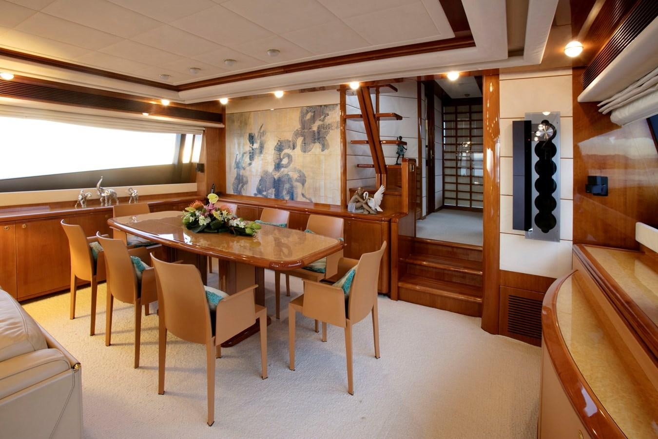 a room with a table and chairs aboard LADY VICTORIA Yacht for Sale