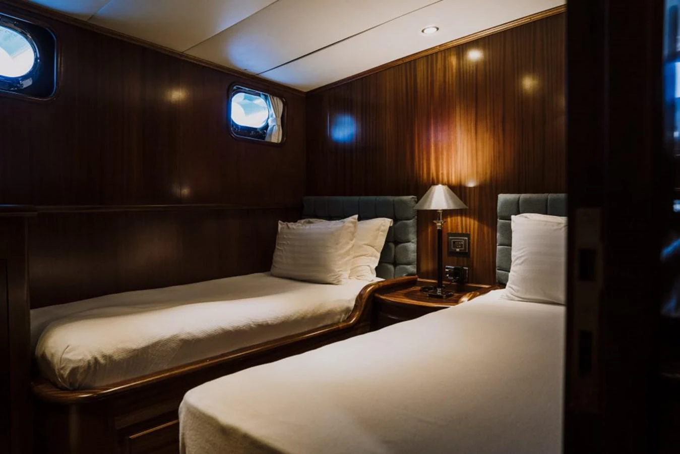 a room with two beds aboard CAPRICORN 1 Yacht for Sale