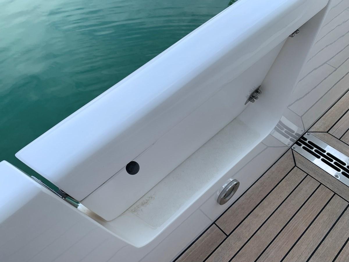 a white boat in a body of water aboard KAPUSHA Yacht for Sale