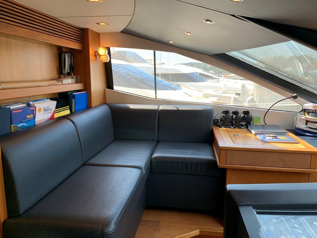 a room with a couch and a desk aboard KAPUSHA Yacht for Sale