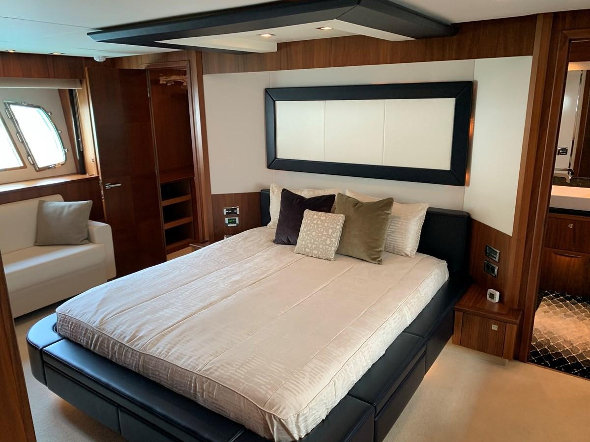 a bed in a room aboard KAPUSHA Yacht for Sale