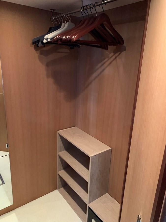 a wooden shelf with a light fixture aboard KAPUSHA Yacht for Sale