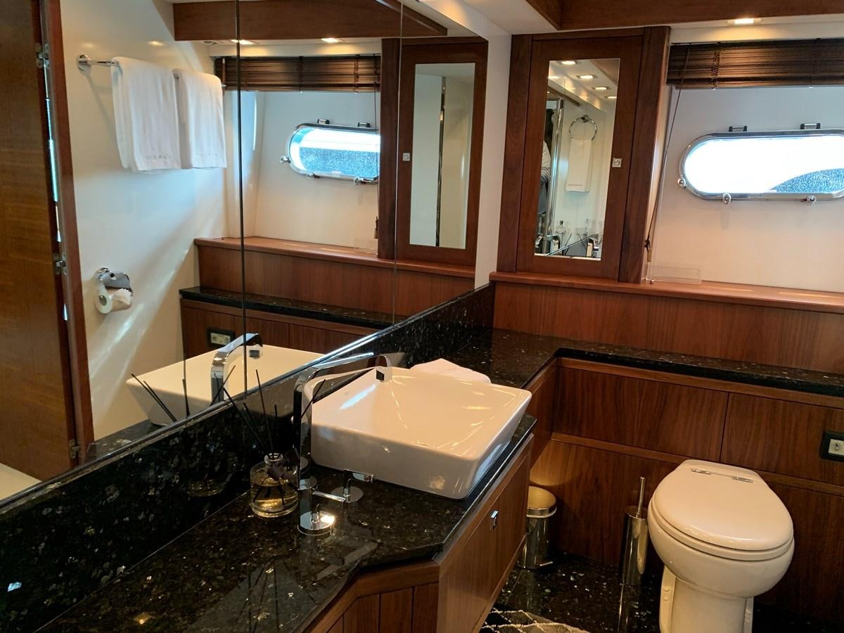 a bathroom with a large mirror aboard KAPUSHA Yacht for Sale