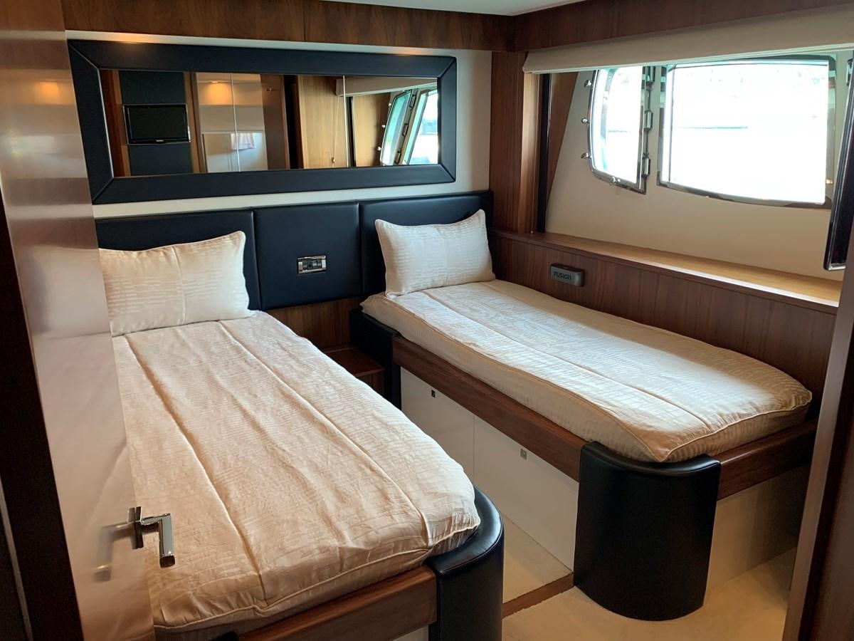 a bed in a room aboard KAPUSHA Yacht for Sale