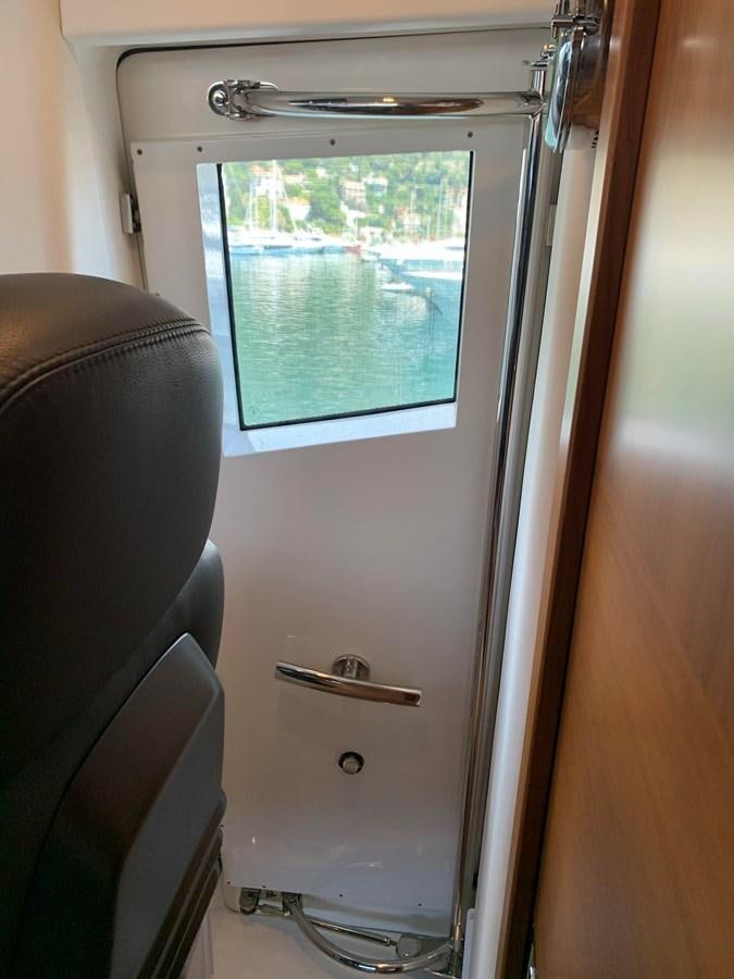 a door with a window aboard KAPUSHA Yacht for Sale