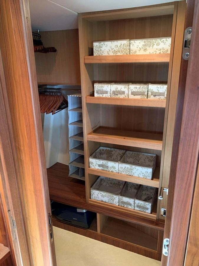 a cabinet with shelves and a door aboard KAPUSHA Yacht for Sale