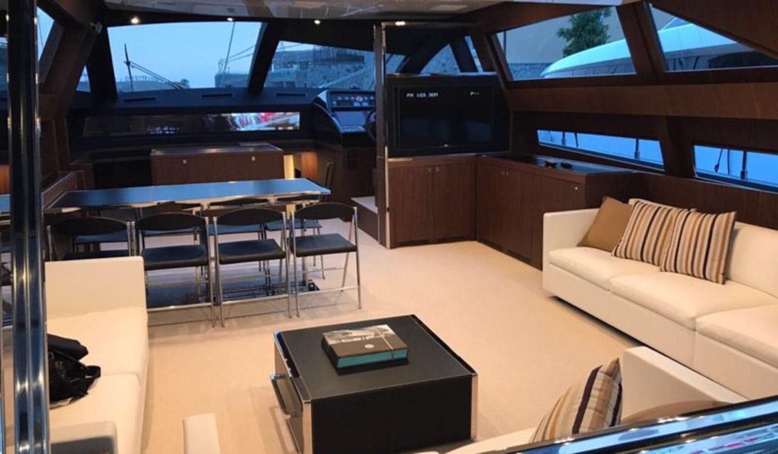 a room with a couch and a table and chairs aboard DOMINO Yacht for Sale