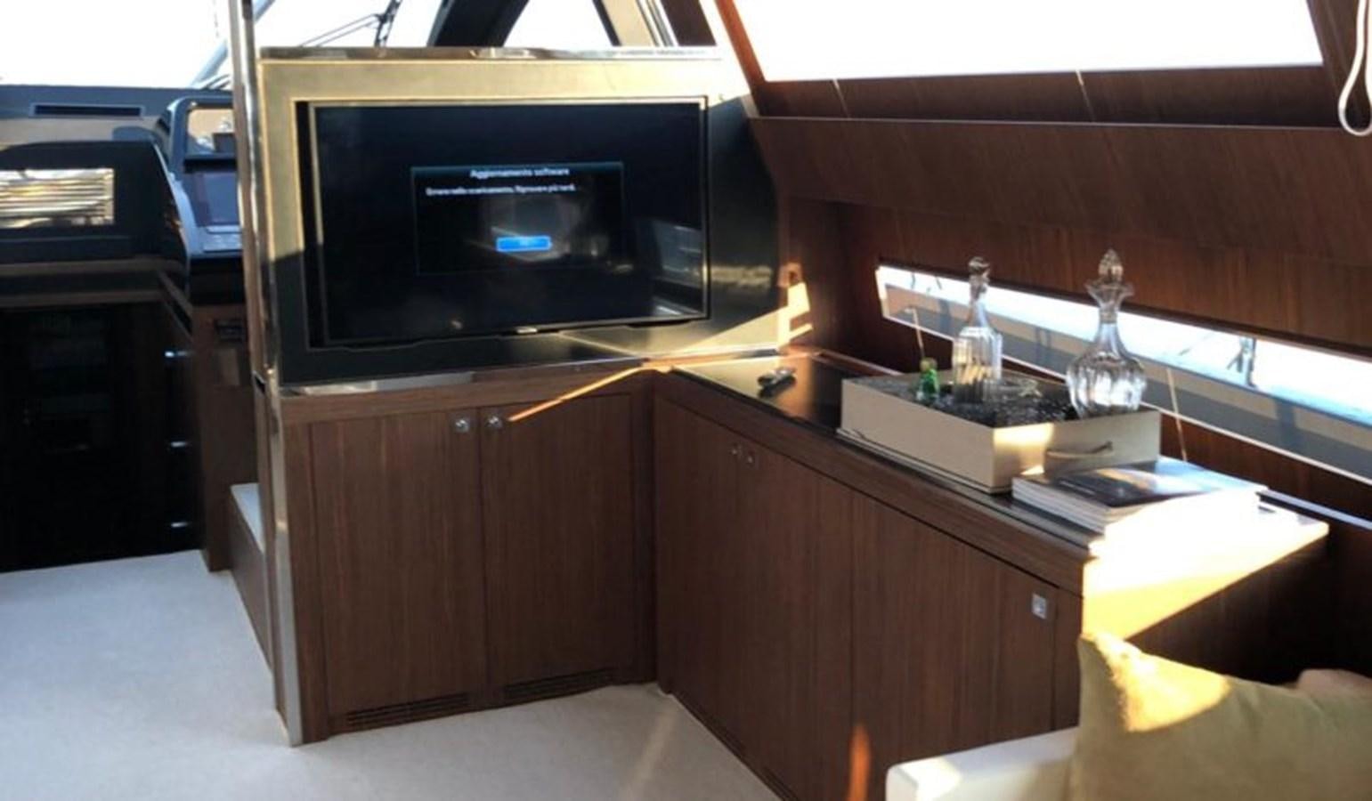 a room with a tv and a cabinet aboard DOMINO Yacht for Sale
