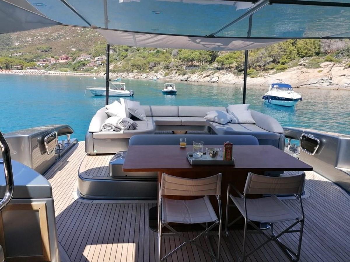 a table and chairs on a deck aboard FIRST SIGNS Yacht for Sale