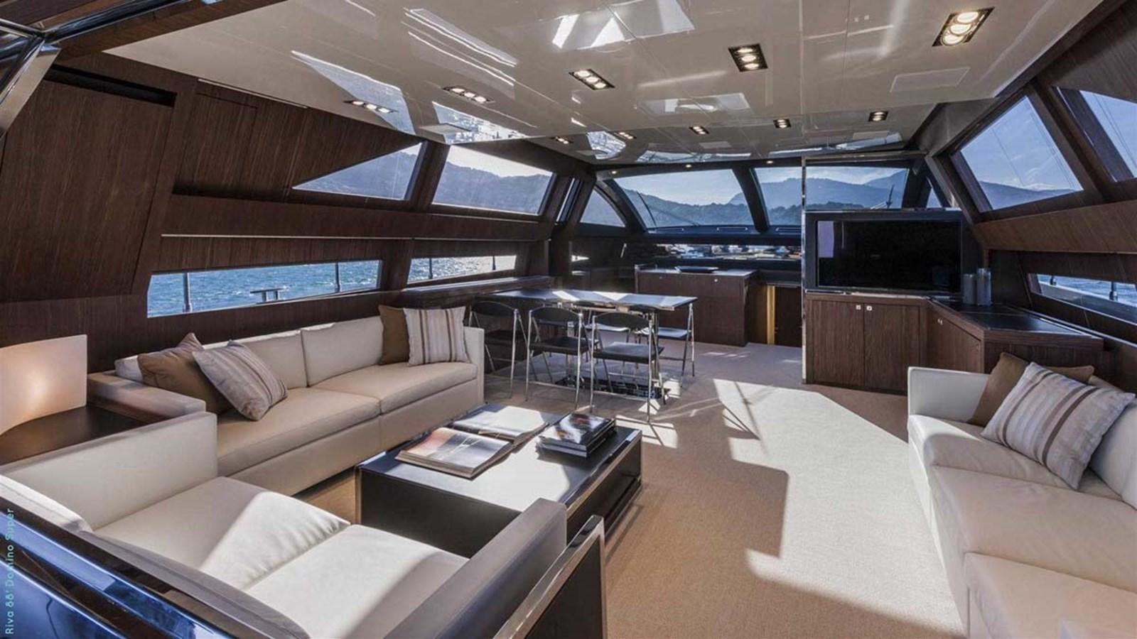 a room with a couch and a table and a tv aboard FIRST SIGNS Yacht for Sale