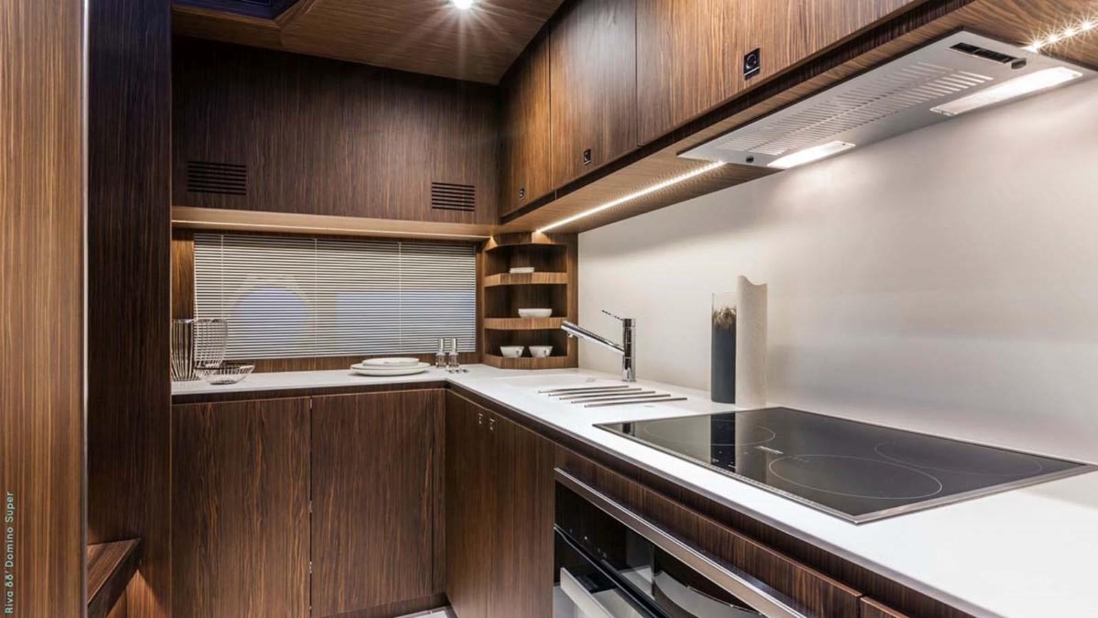 a kitchen with a stove and a sink aboard FIRST SIGNS Yacht for Sale
