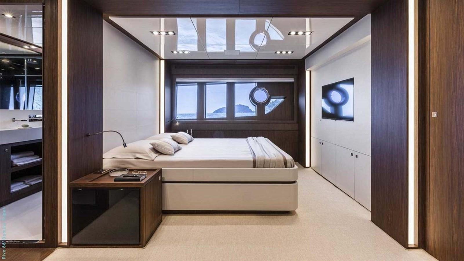 a room with a bed and a desk aboard FIRST SIGNS Yacht for Sale