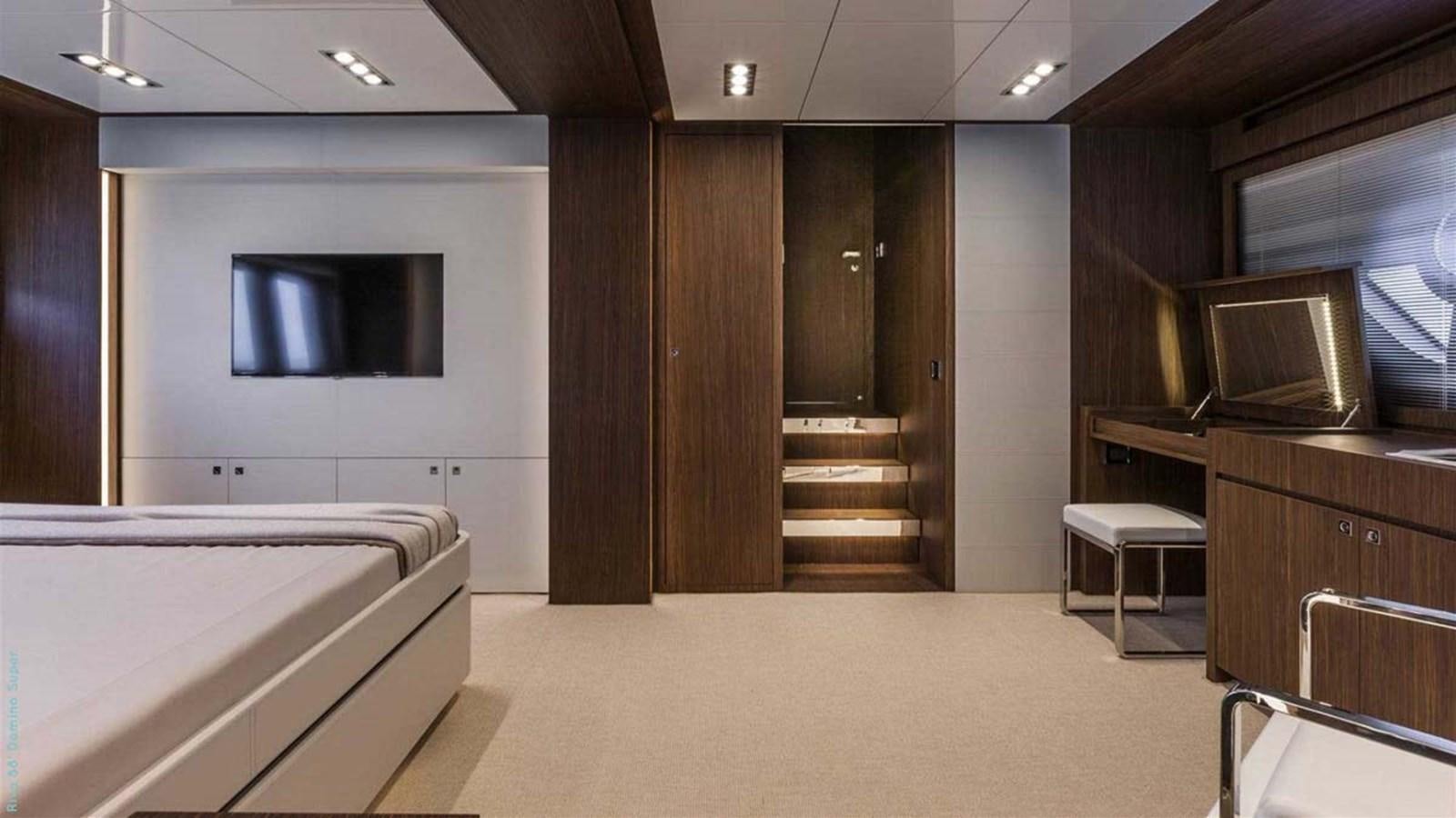 a room with a bed and a tv aboard FIRST SIGNS Yacht for Sale