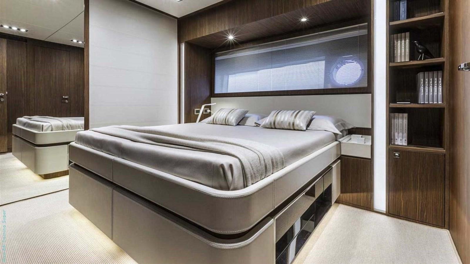 a bed in a room aboard FIRST SIGNS Yacht for Sale