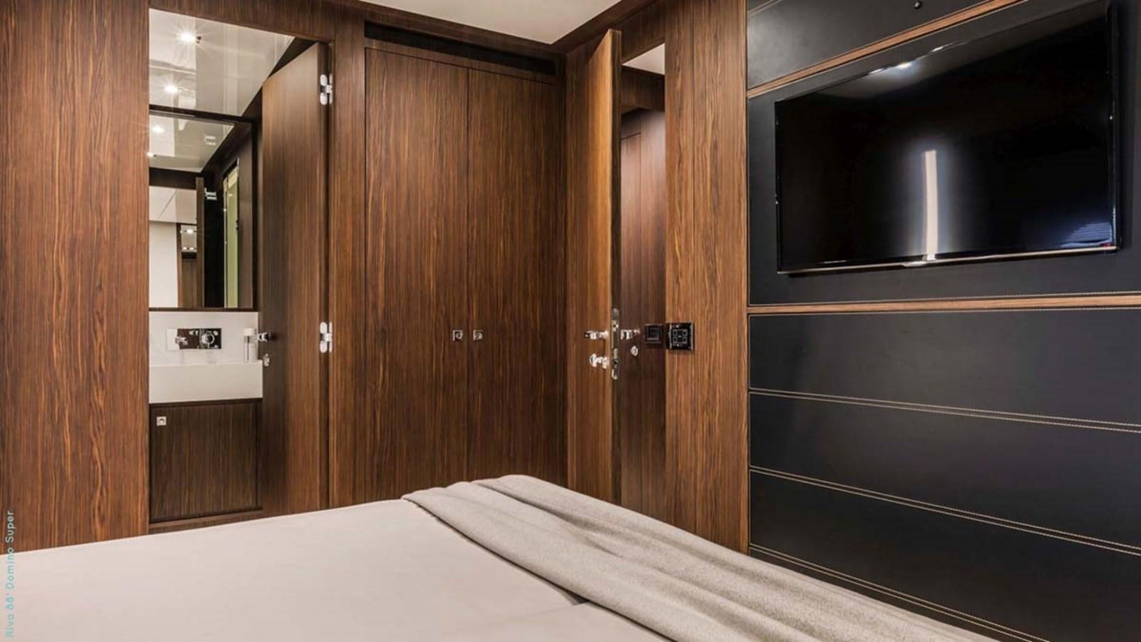 a room with a bed and a closet aboard FIRST SIGNS Yacht for Sale