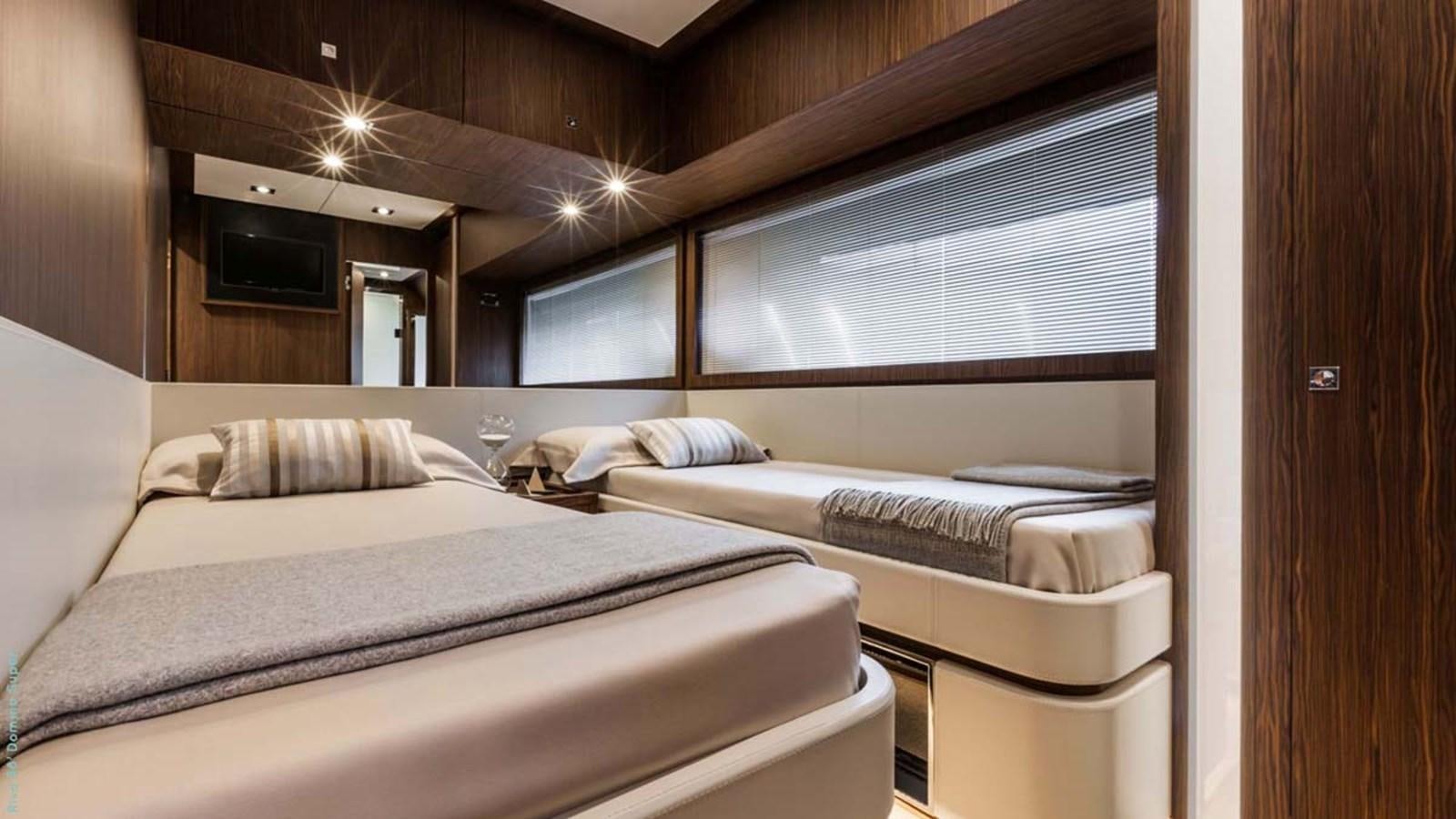 a room with several beds aboard FIRST SIGNS Yacht for Sale