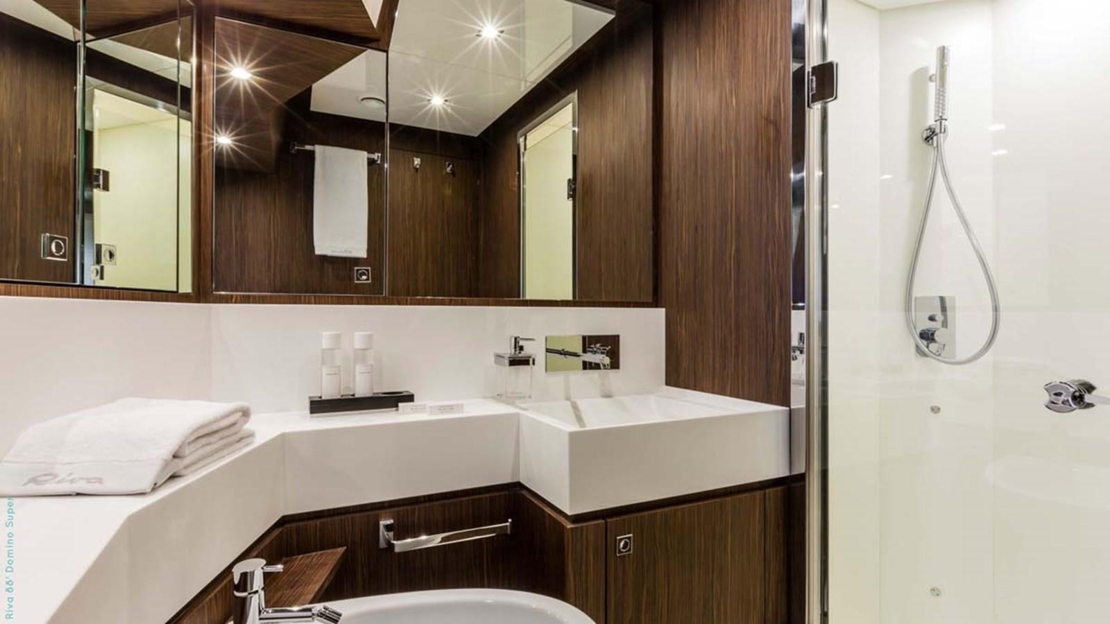 a bathroom with a large mirror aboard FIRST SIGNS Yacht for Sale