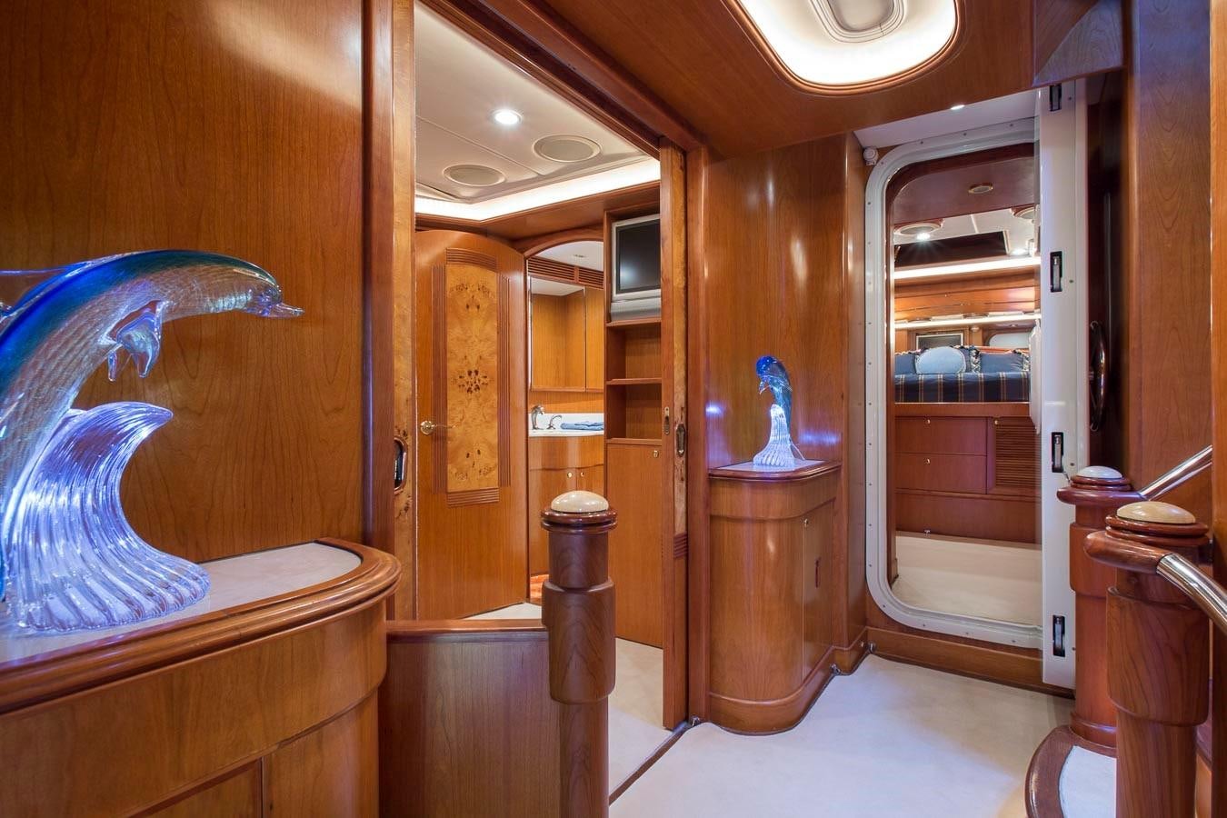 a room with a large mirror and a statue in it aboard SILVER WINGS Yacht for Sale