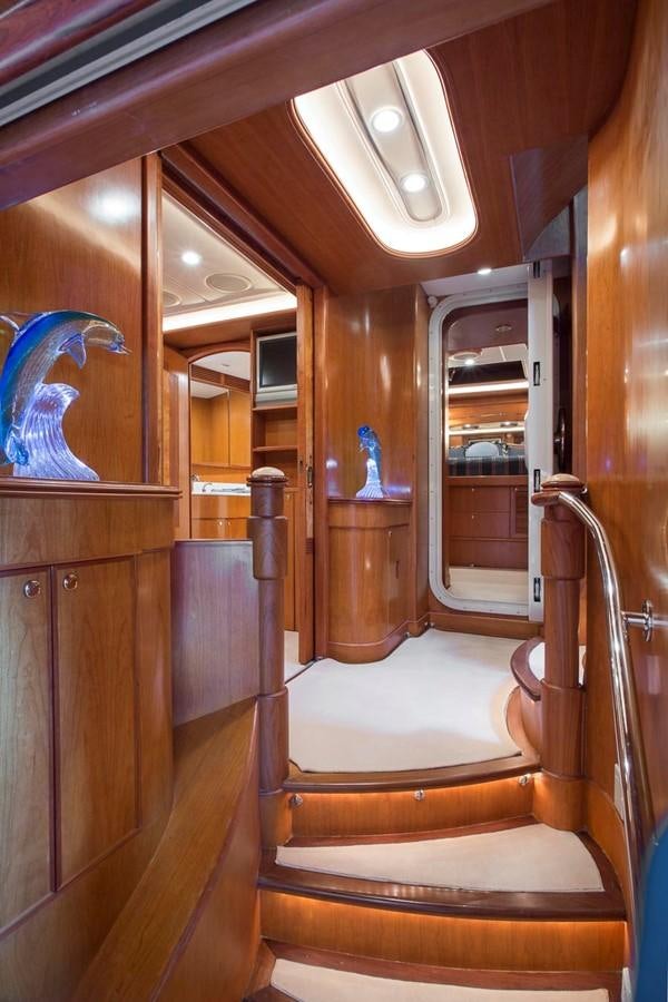 a wooden staircase in a house aboard SILVER WINGS Yacht for Sale