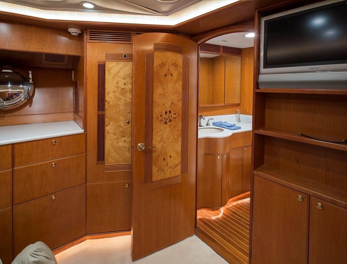 a room with wooden cabinets aboard SILVER WINGS Yacht for Sale