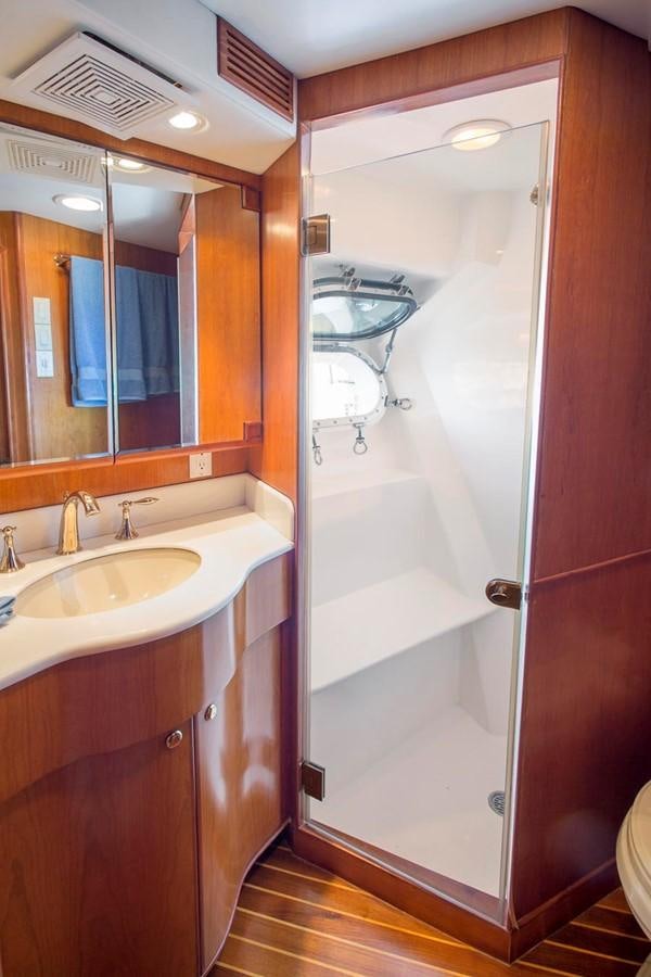 a bathroom with a sink and a mirror aboard SILVER WINGS Yacht for Sale