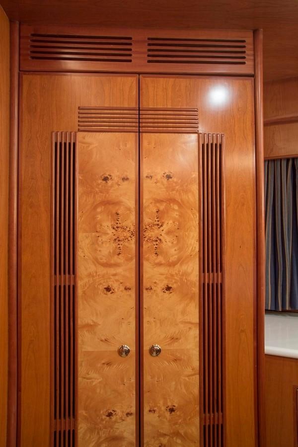 a wooden door with a glass frame aboard SILVER WINGS Yacht for Sale
